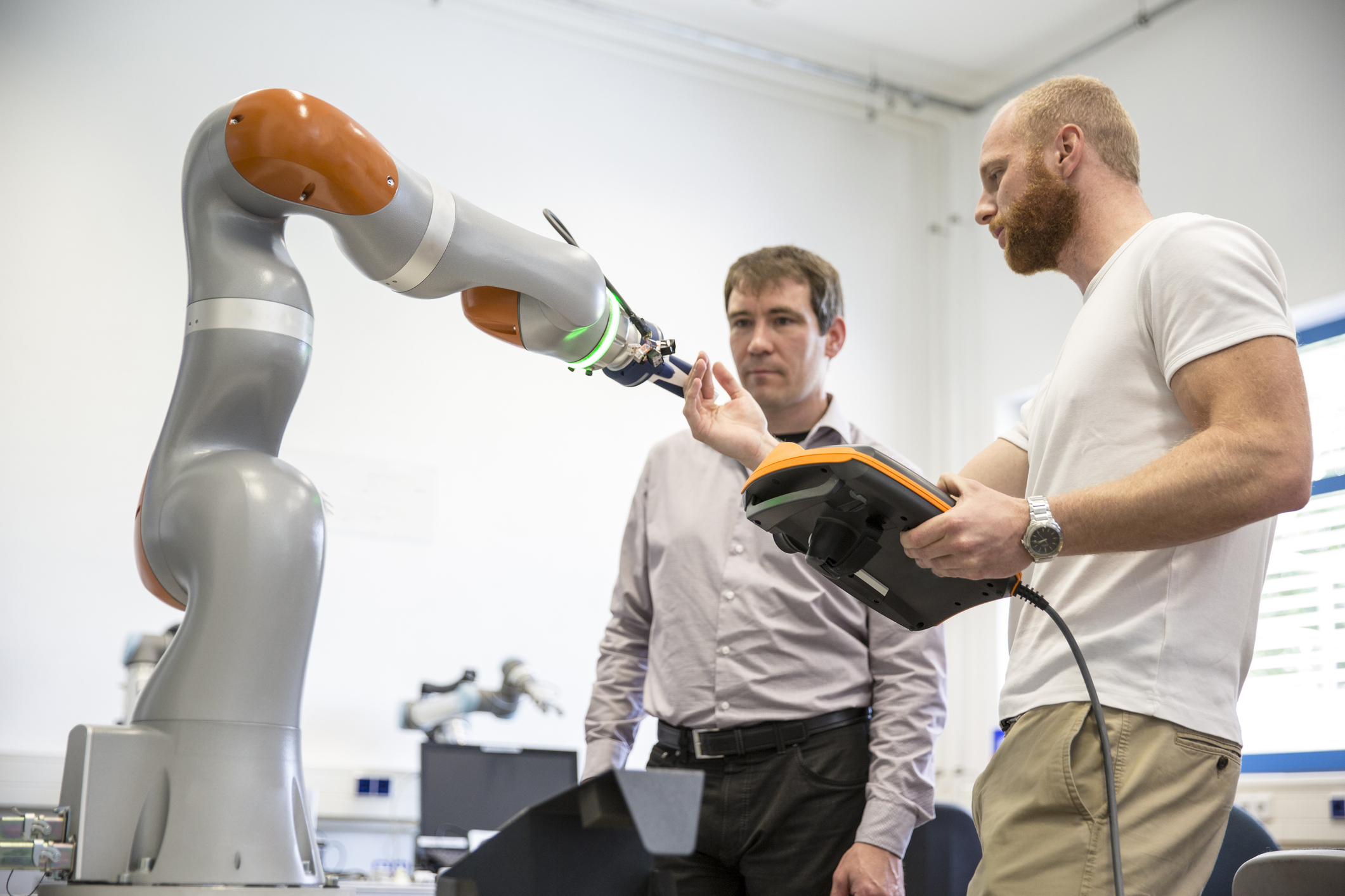 Human–robot interactions and experiences of staff and service robots in aged care