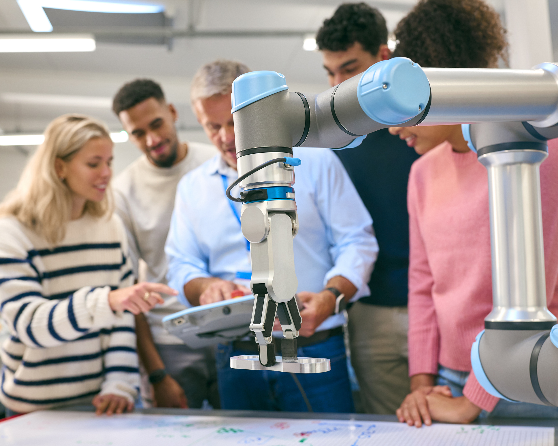 The Design of Extended Reality-enabled Tangible Interaction to Enhance the Interaction with Collaborative Robots